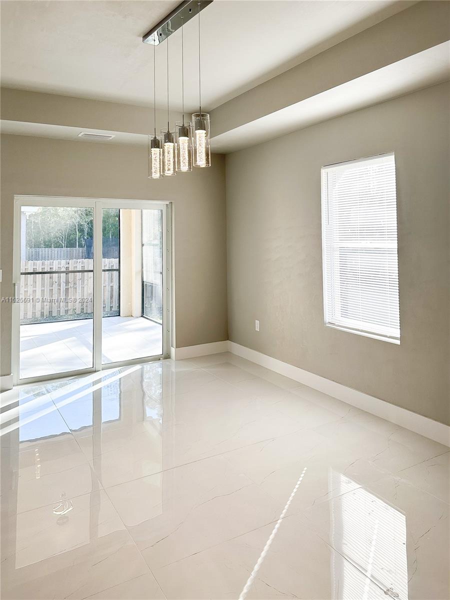 828 Homestead Road South Lehigh Acres, FL 33974 - Photo 25 of 48 a view of an empty room with a window
