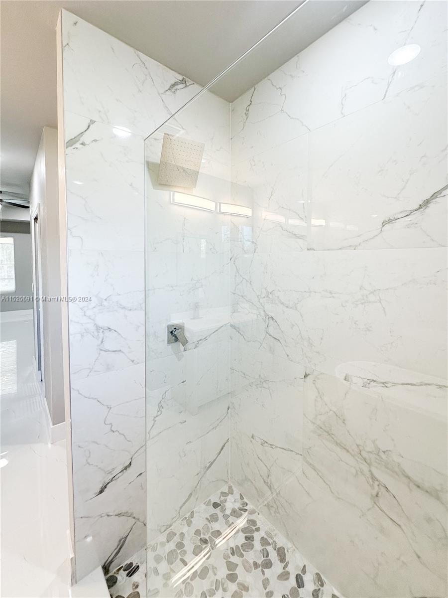 828 Homestead Road South Lehigh Acres, FL 33974 - Photo 33 of 48 a bathroom with a shower