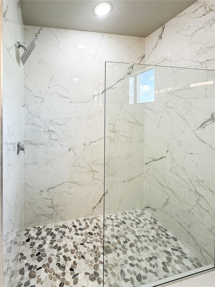 828 Homestead Road South Lehigh Acres, FL 33974 - Photo 36 of 48 a bathroom with a shower