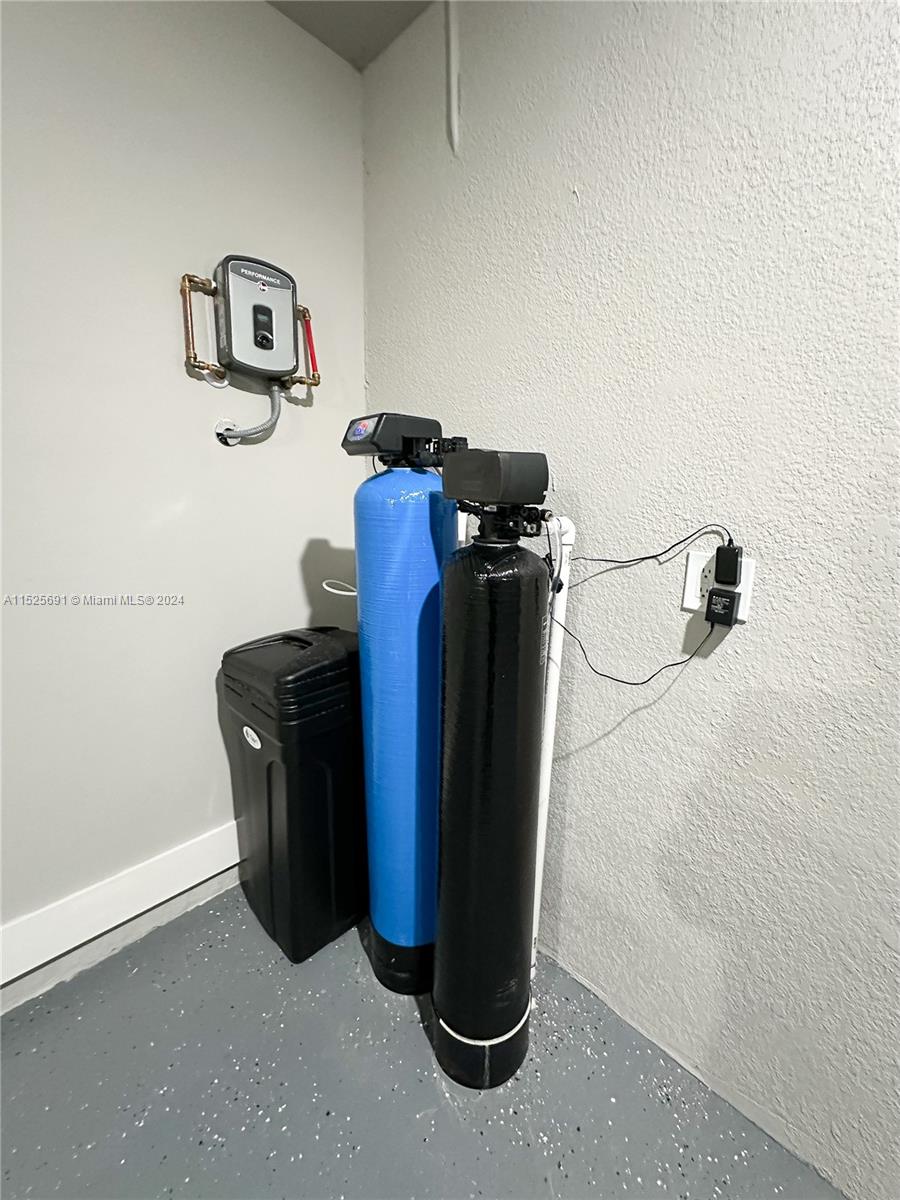 828 Homestead Road South Lehigh Acres, FL 33974 - Photo 39 of 48 a view of storage room