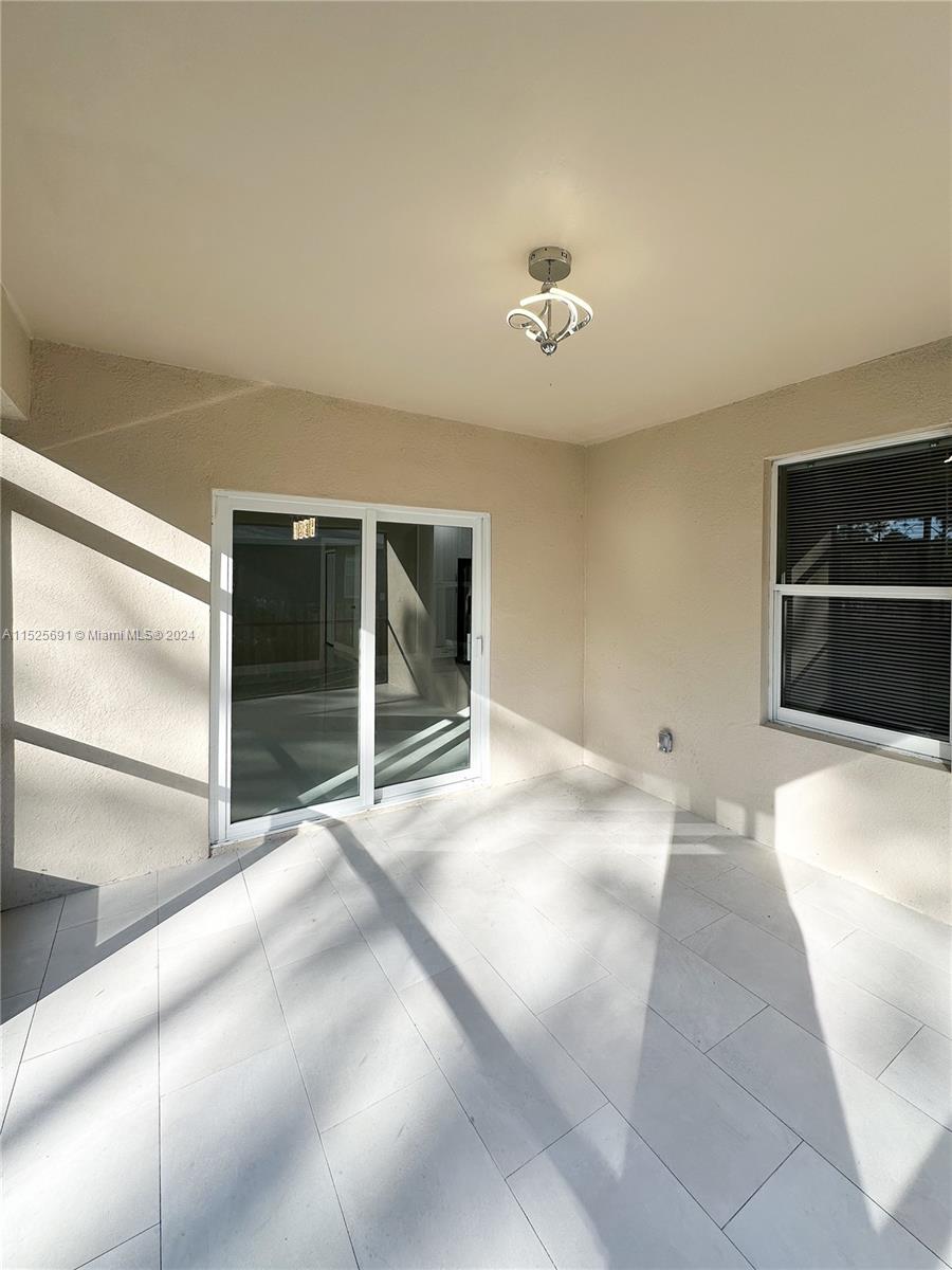 828 Homestead Road South Lehigh Acres, FL 33974 - Photo 42 of 48 a view of an empty room with a fireplace