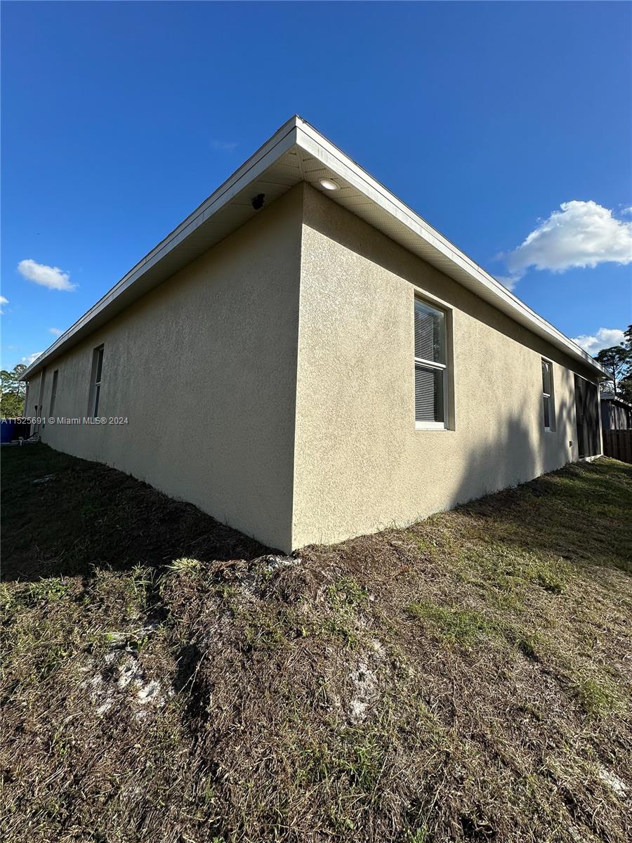 828 Homestead Road South Lehigh Acres, FL 33974 - Photo 45 of 48 a backyard of a house