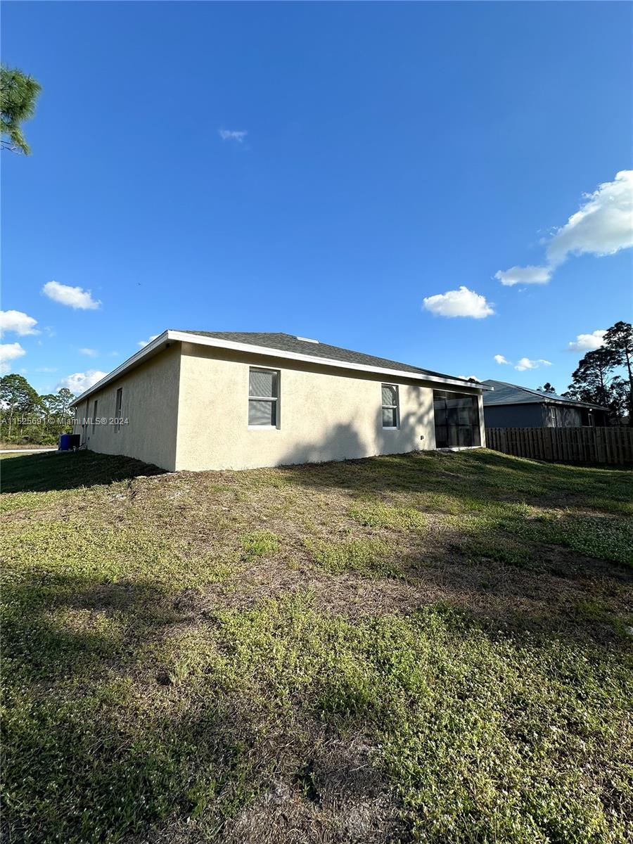 828 Homestead Road South Lehigh Acres, FL 33974 - Photo 47 of 48 a view of a backyard