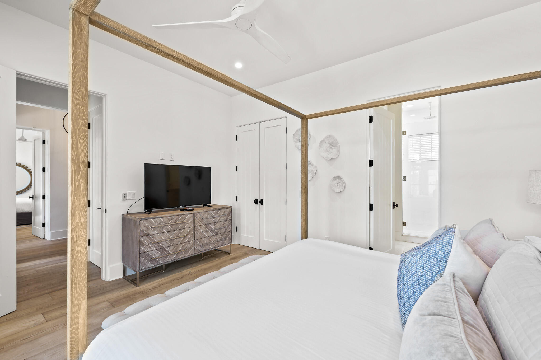 390 Walton Rose Lane Inlet Beach, FL 32461 - Photo 13 of 72 a spacious bedroom with a bed and a flat screen tv