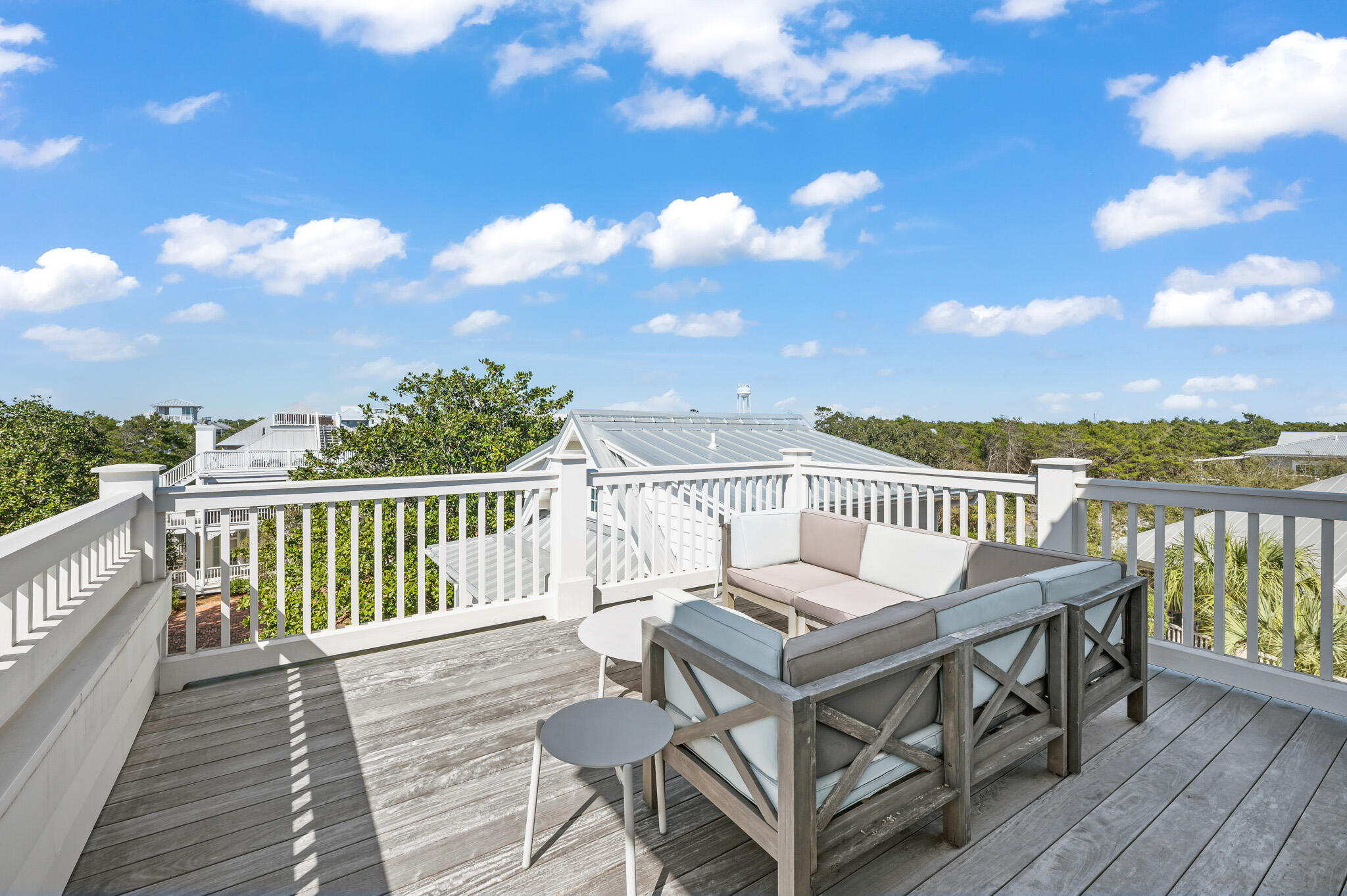 390 Walton Rose Lane Inlet Beach, FL 32461 - Photo 41 of 72 a view of a balcony with wooden chairs
