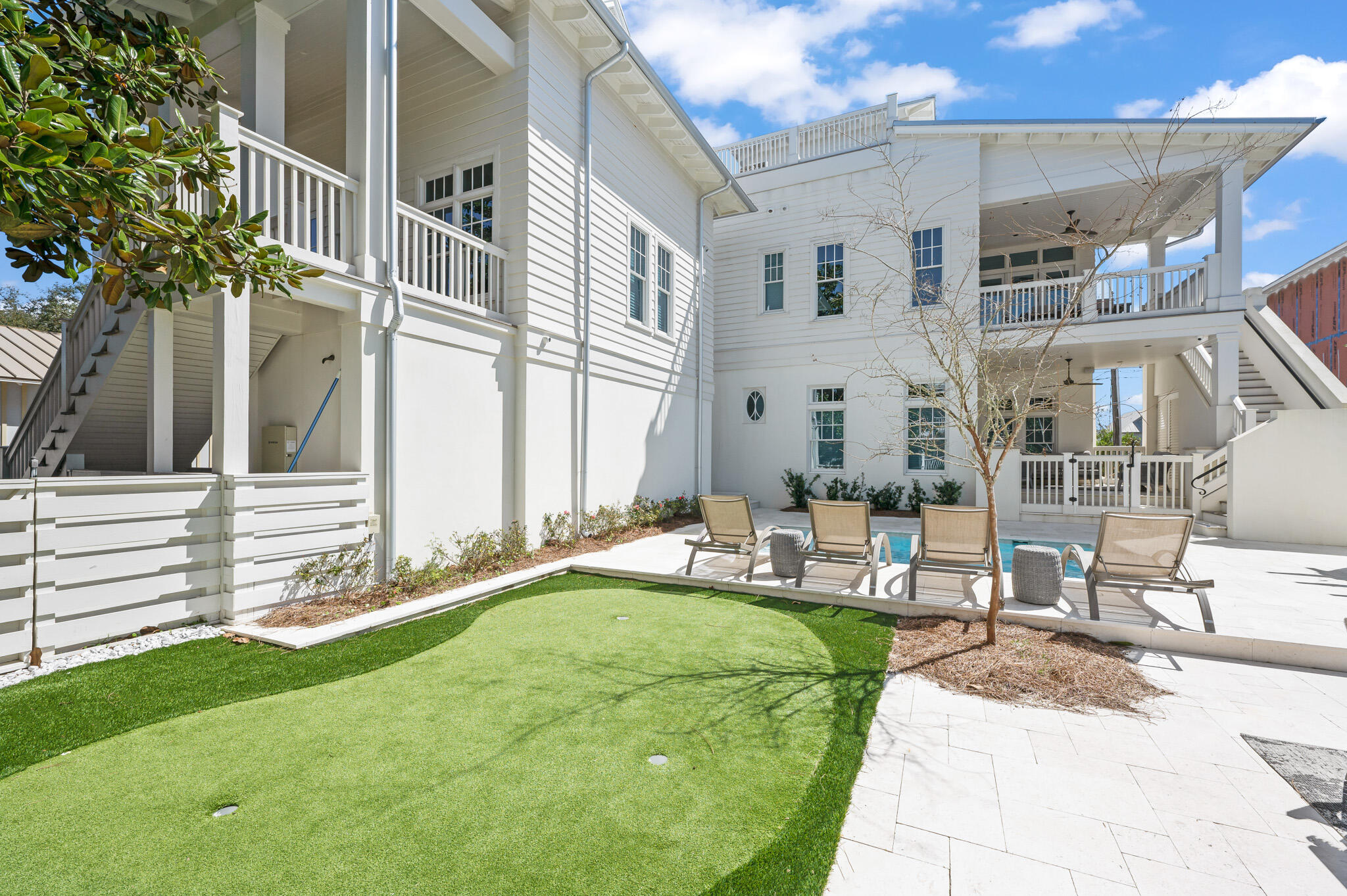 390 Walton Rose Lane Inlet Beach, FL 32461 - Photo 48 of 72 a front view of a house with a garden and patio