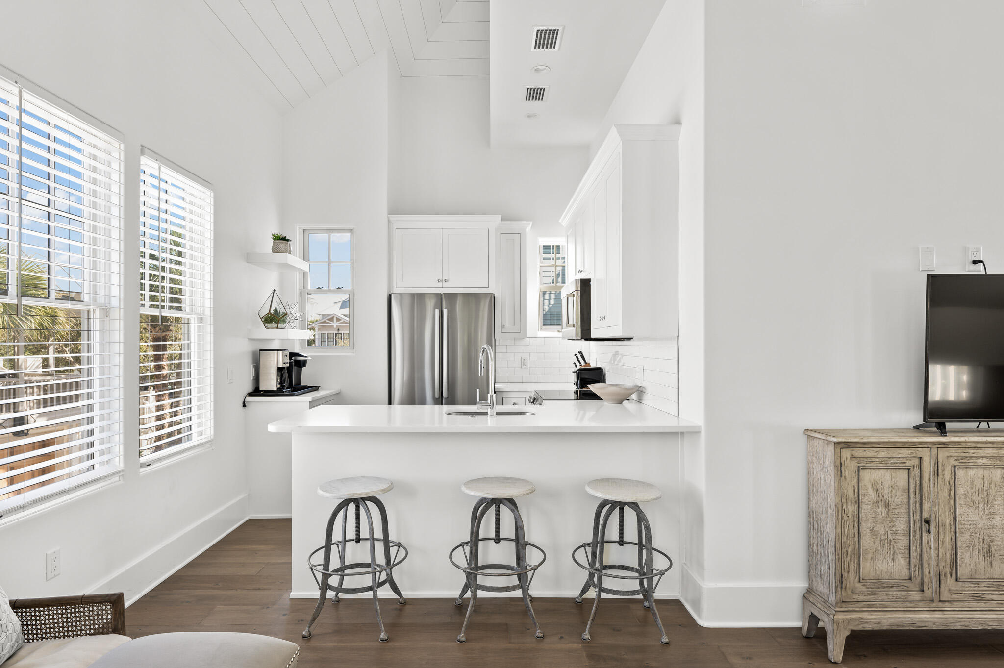 390 Walton Rose Lane Inlet Beach, FL 32461 - Photo 57 of 72 a kitchen with stainless steel appliances a table and chairs