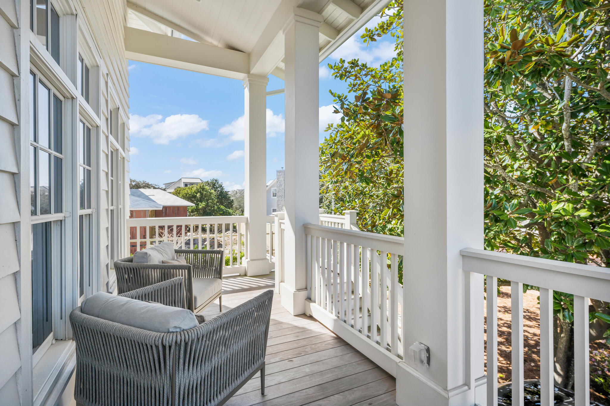 390 Walton Rose Lane Inlet Beach, FL 32461 - Photo 67 of 72 a balcony with wooden floor outdoor seating and plants