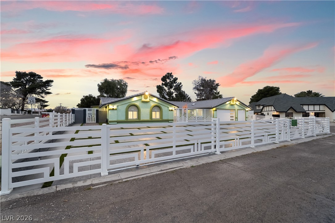 3160 East Viking Road Las Vegas, NV 89121 - Photo 12 of 99 View of front of property with a fenced front yard
