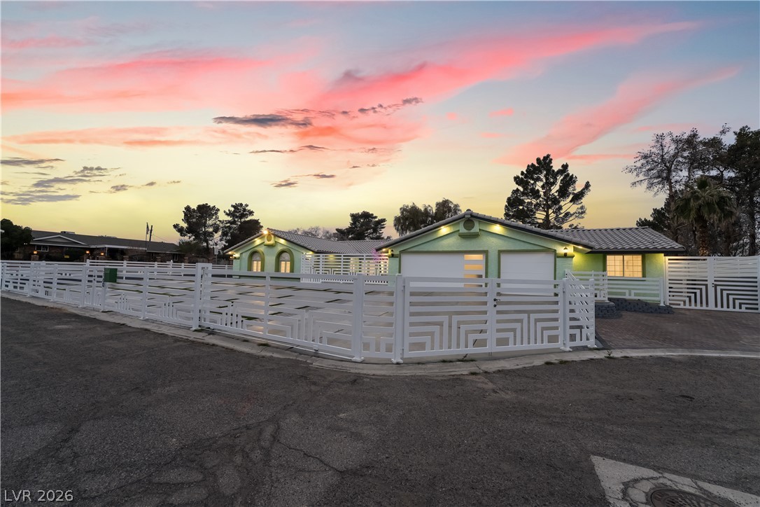 3160 East Viking Road Las Vegas, NV 89121 - Photo 14 of 99 View of front of house with a fenced front yard and a metal roof