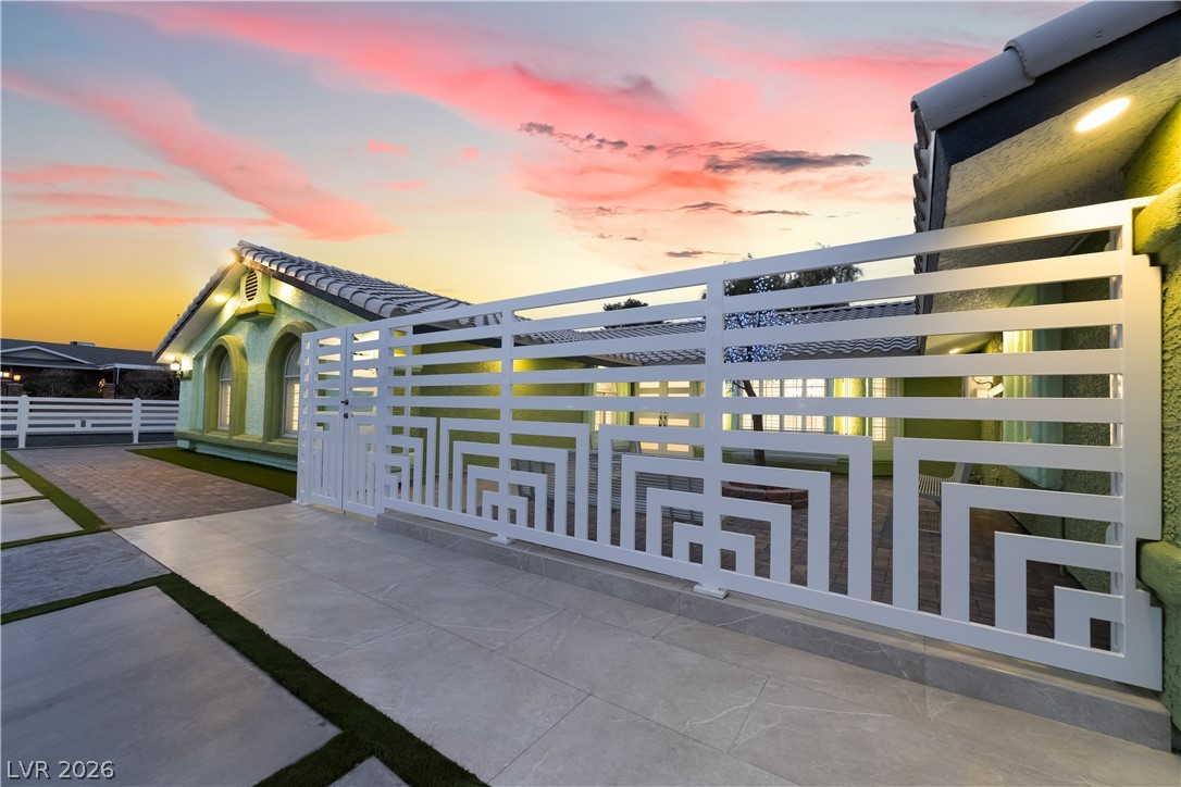 3160 East Viking Road Las Vegas, NV 89121 - Photo 20 of 99 View of gate at dusk