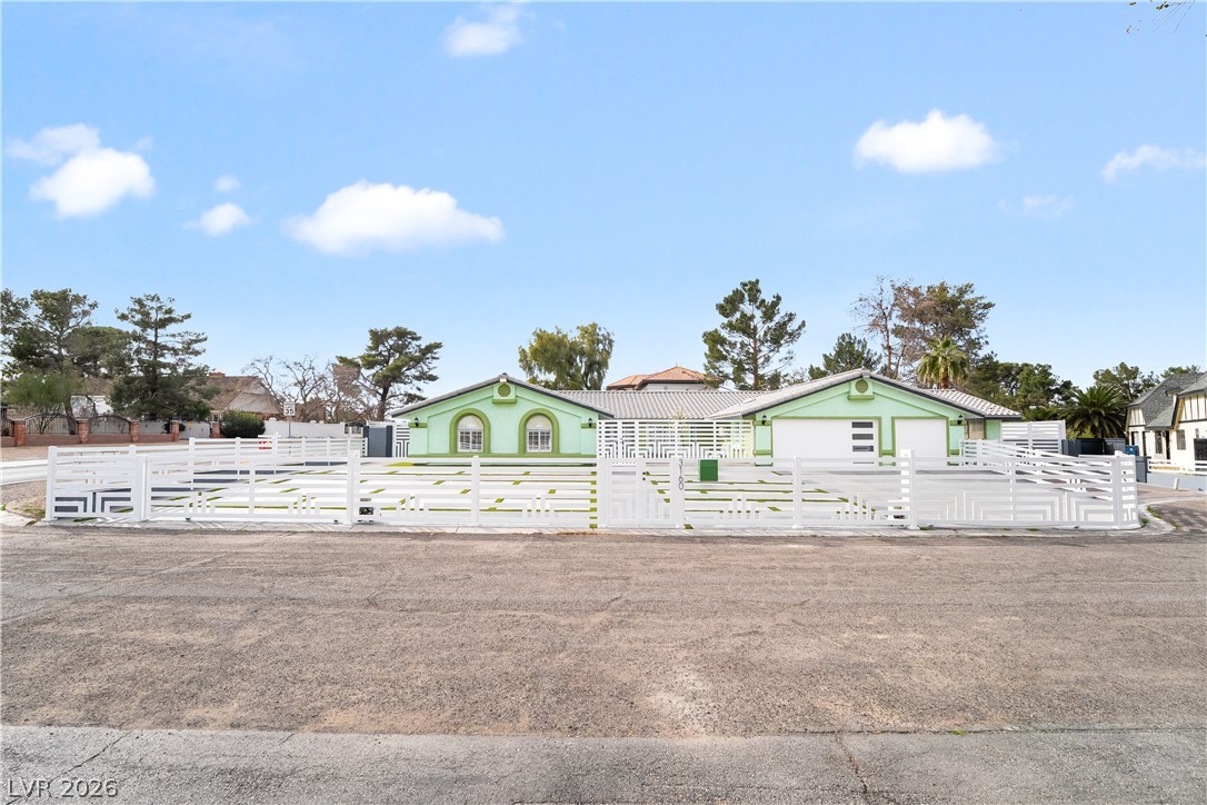 3160 East Viking Road Las Vegas, NV 89121 - Photo 27 of 99 View of front facade featuring a fenced front yard and a gate
