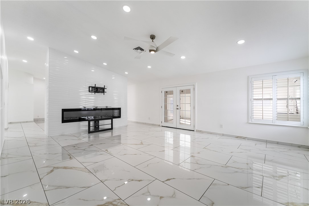 3160 East Viking Road Las Vegas, NV 89121 - Photo 45 of 99 Living area with french doors, ceiling fan, and recessed lighting
