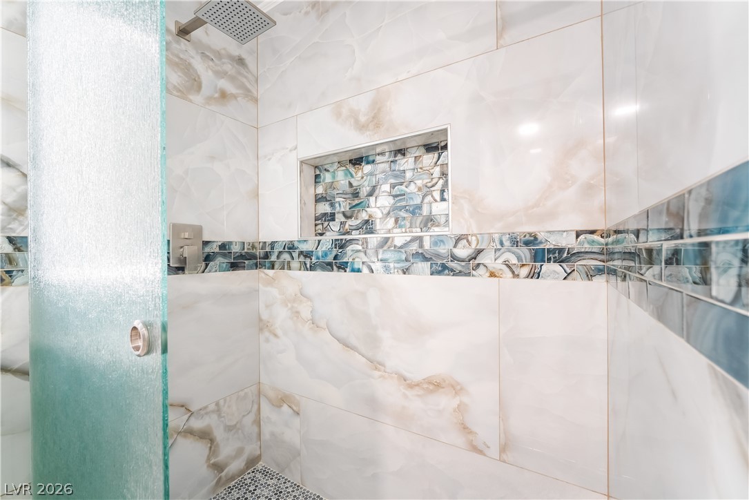 3160 East Viking Road Las Vegas, NV 89121 - Photo 59 of 99 Full bathroom featuring a tile shower