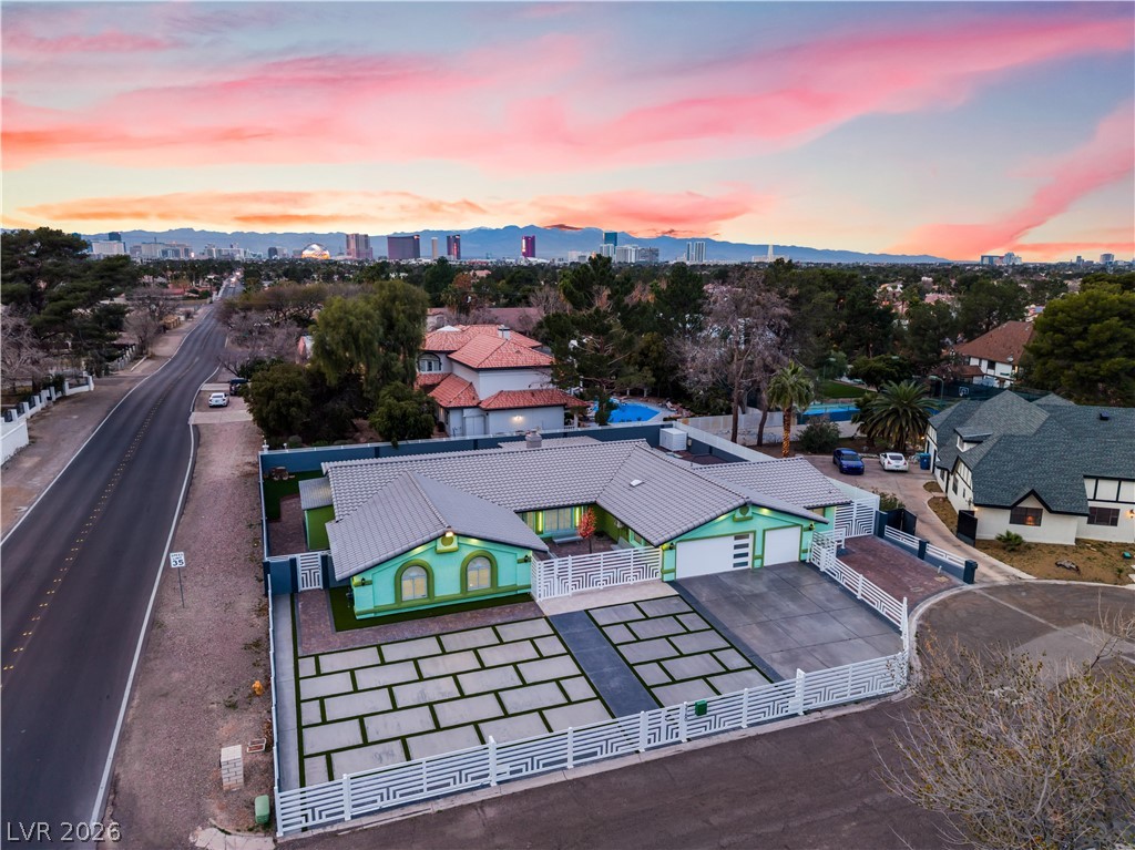 3160 East Viking Road Las Vegas, NV 89121 - Photo 6 of 99 Aerial view at dusk of a mountain view and a residential view
