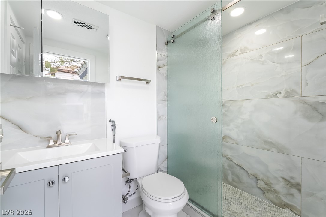 3160 East Viking Road Las Vegas, NV 89121 - Photo 64 of 99 Full bath featuring vanity, a stall shower, and recessed lighting