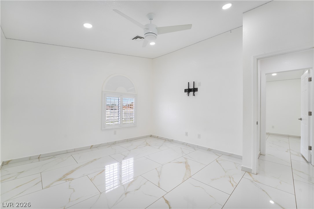 3160 East Viking Road Las Vegas, NV 89121 - Photo 77 of 99 Unfurnished room featuring ceiling fan, light marble finish flooring, and recessed lighting