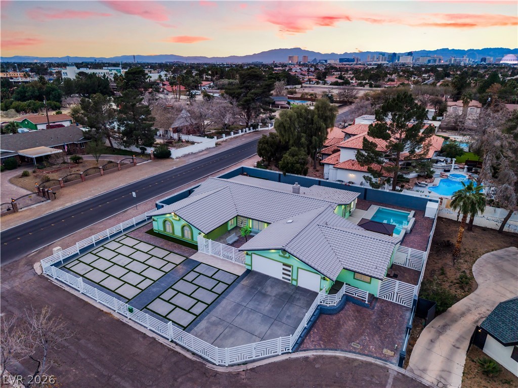 3160 East Viking Road Las Vegas, NV 89121 - Photo 8 of 99 Aerial view at dusk of a mountain view and a residential view