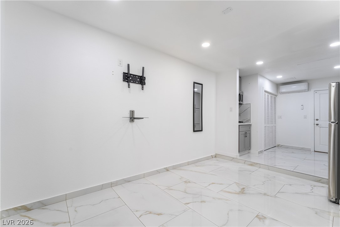 3160 East Viking Road Las Vegas, NV 89121 - Photo 85 of 99 Empty room with recessed lighting and light marble finish floors