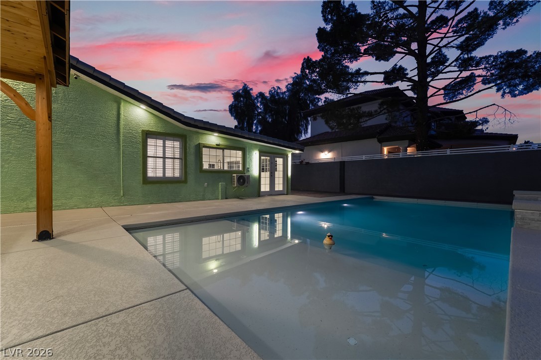 3160 East Viking Road Las Vegas, NV 89121 - Photo 92 of 99 Swimming pool with french doors and a patio