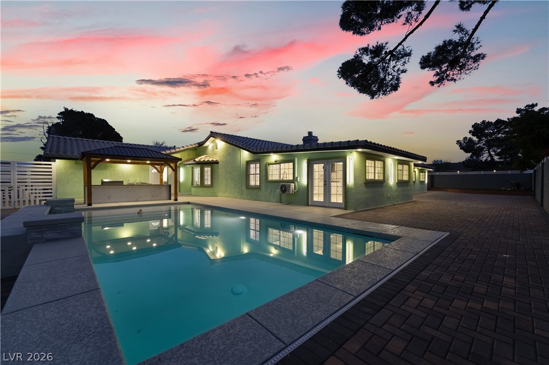3160 East Viking Road Las Vegas, NV 89121 - Photo 94 of 99 View of swimming pool with a fenced backyard, french doors, a gazebo, patio surround, and a hot tub