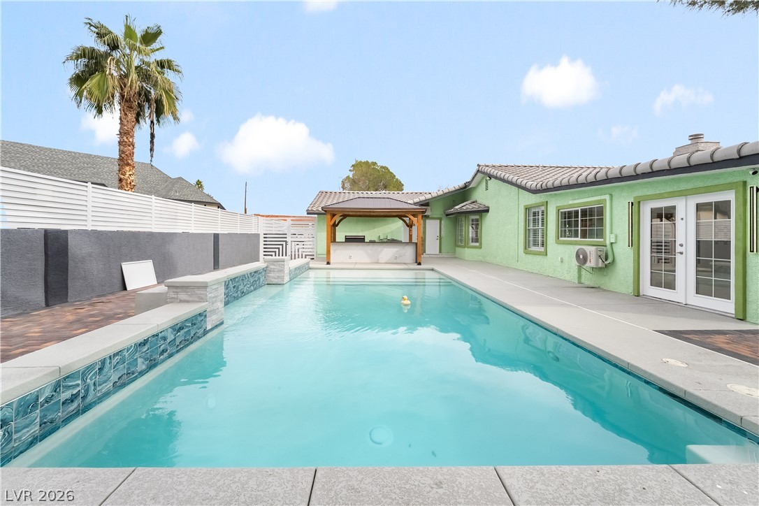 3160 East Viking Road Las Vegas, NV 89121 - Photo 96 of 99 View of pool featuring french doors, a gazebo, and patio surround