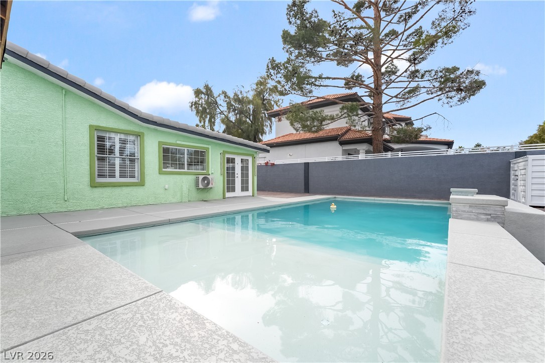 3160 East Viking Road Las Vegas, NV 89121 - Photo 97 of 99 View of swimming pool with a fenced backyard, french doors, and patio surround