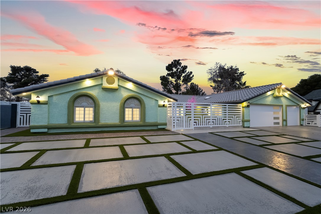 3160 East Viking Road Las Vegas, NV 89121 - Photo 10 of 99 View of front facade with a tile roof and a garage