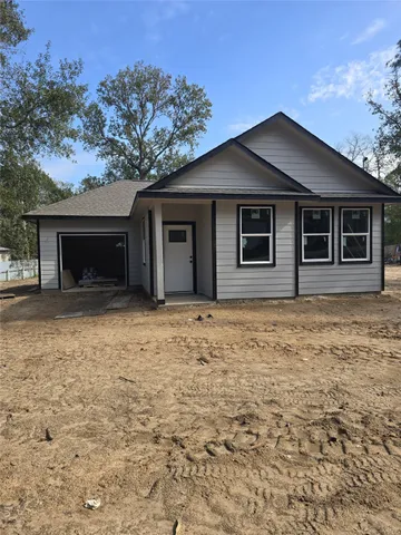 a house with trees in the background
