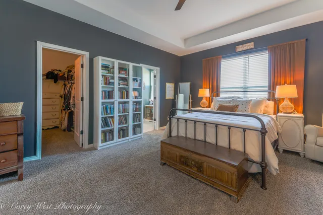 a bed room with a bed and a window