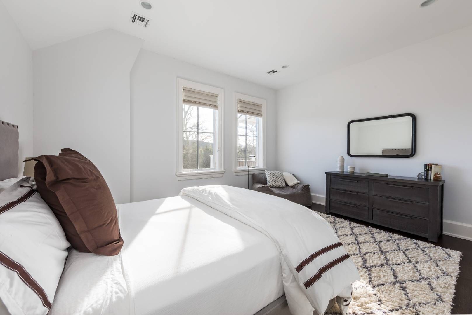 6 Shady Pth Bridgehampton, NY 11963 - Photo 16 of 20 a bedroom with a bed window and mirror