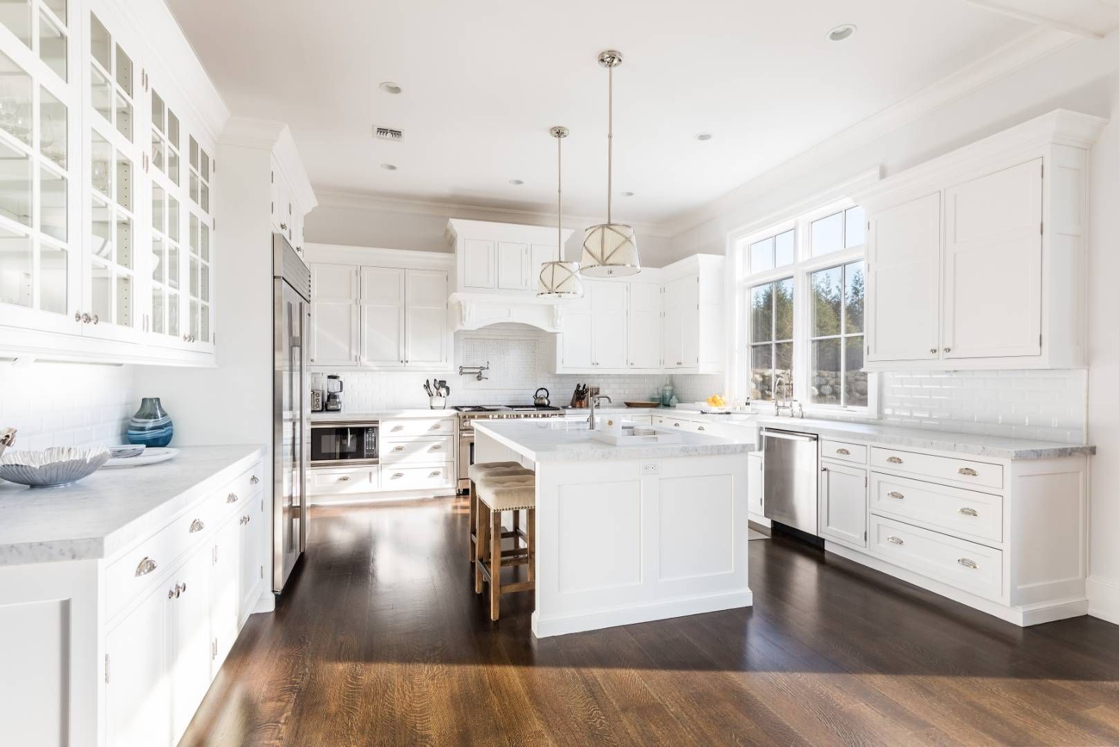 6 Shady Pth Bridgehampton, NY 11963 - Photo 9 of 20 a large kitchen with kitchen island a stove a sink a center island and wooden floor