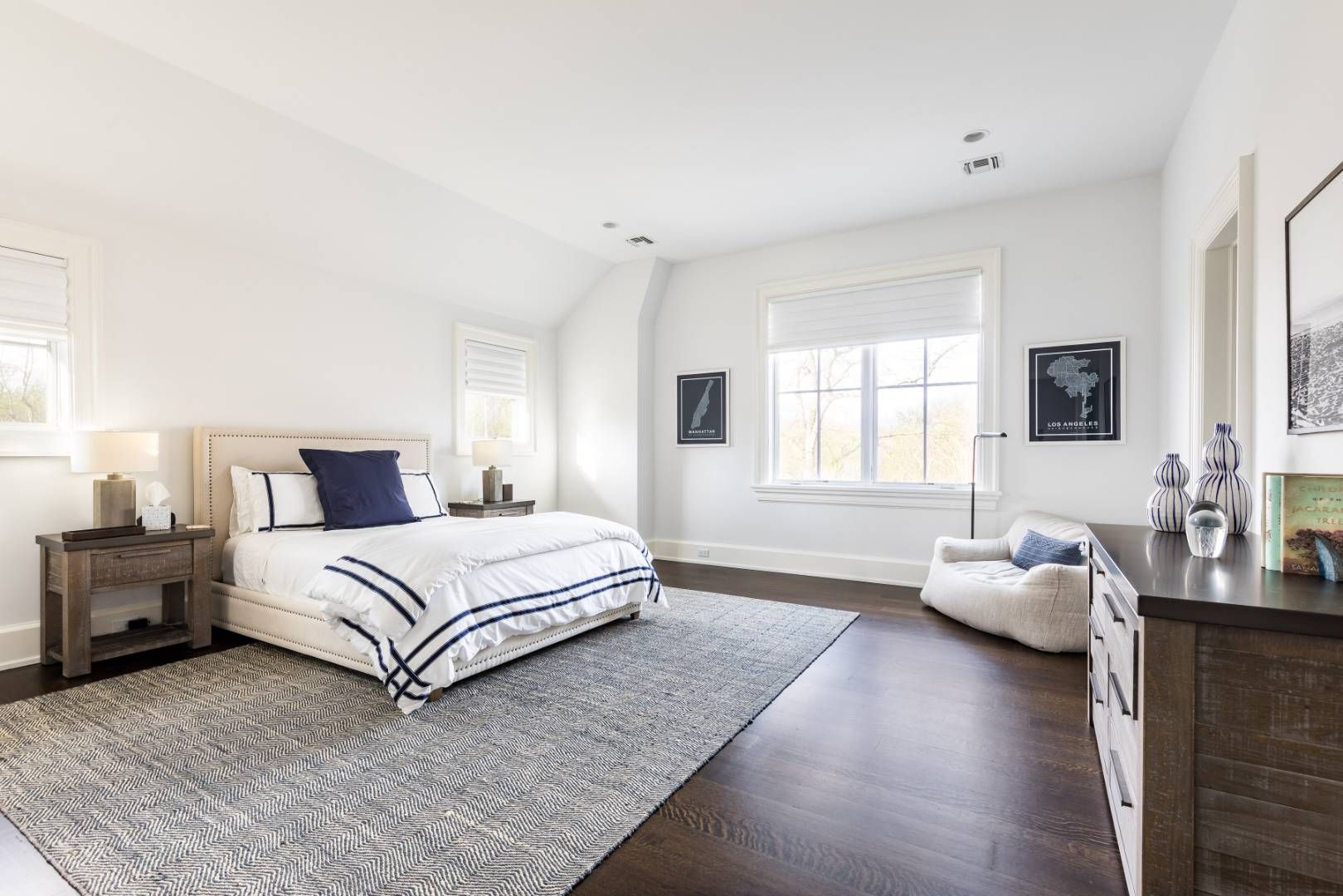 6 Shady Pth Bridgehampton, NY 11963 - Photo 10 of 20 a spacious bedroom with a bed and wooden floor