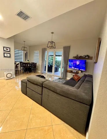 a living room with furniture and a window