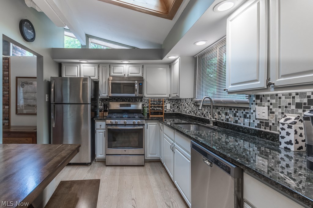 11799 Girdled Road Painesville, OH 44077 - Photo 5 of 26 You'll love cooking in this remodeled kitchen with newer stainless steel appliances remodeled two years ago.