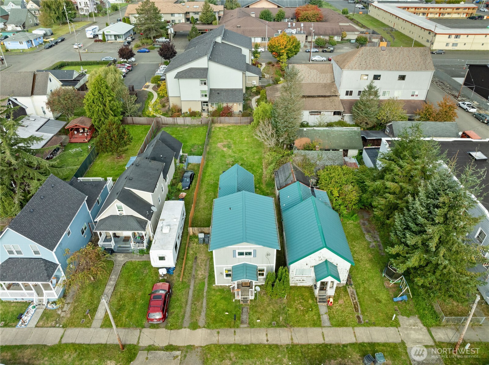 410 11th Street Hoquiam, WA 98550 - Photo 6 of 14 an aerial view of residential houses with outdoor space and parking