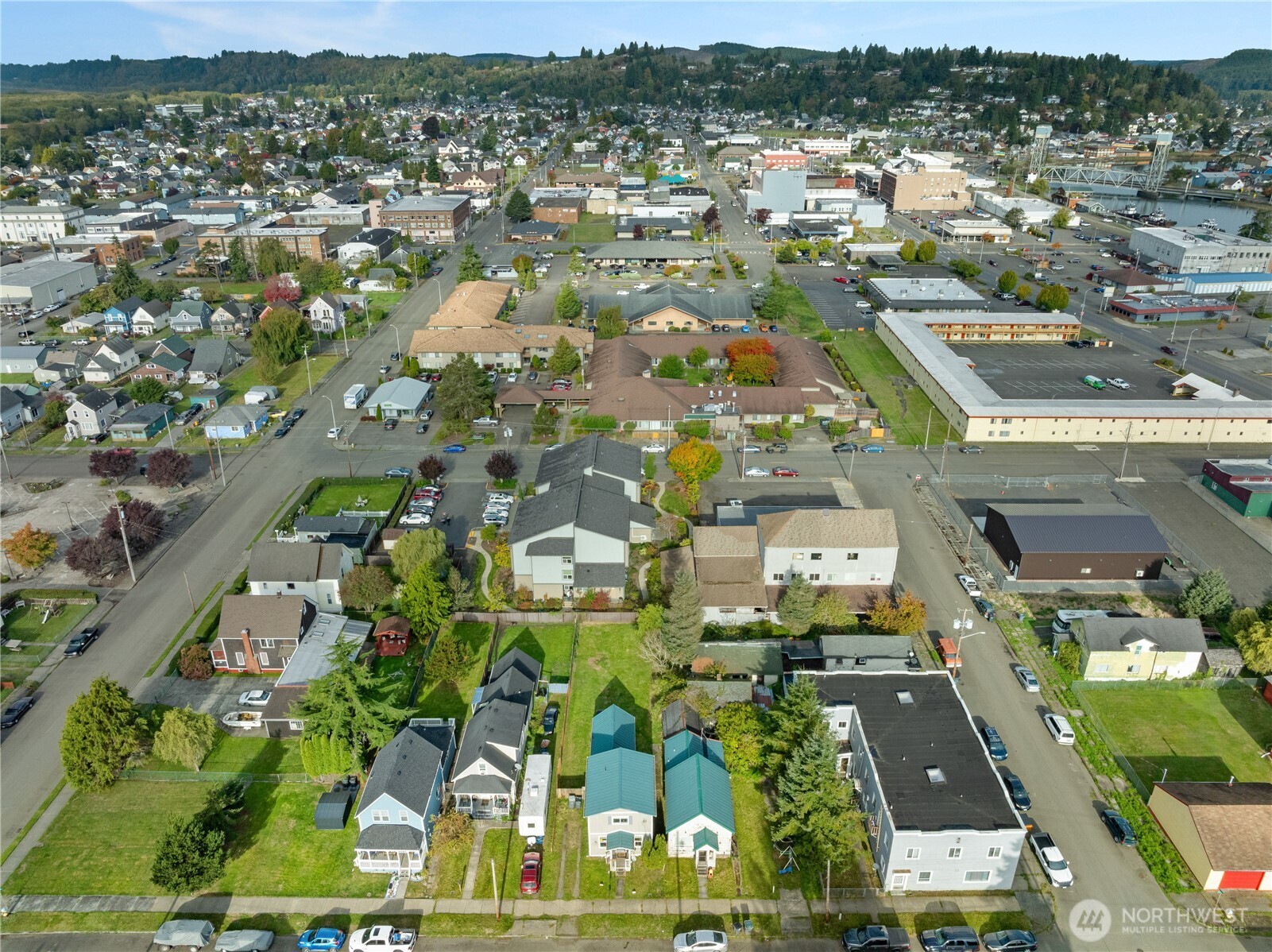 410 11th Street Hoquiam, WA 98550 - Photo 8 of 14 an aerial view of residential houses with outdoor space
