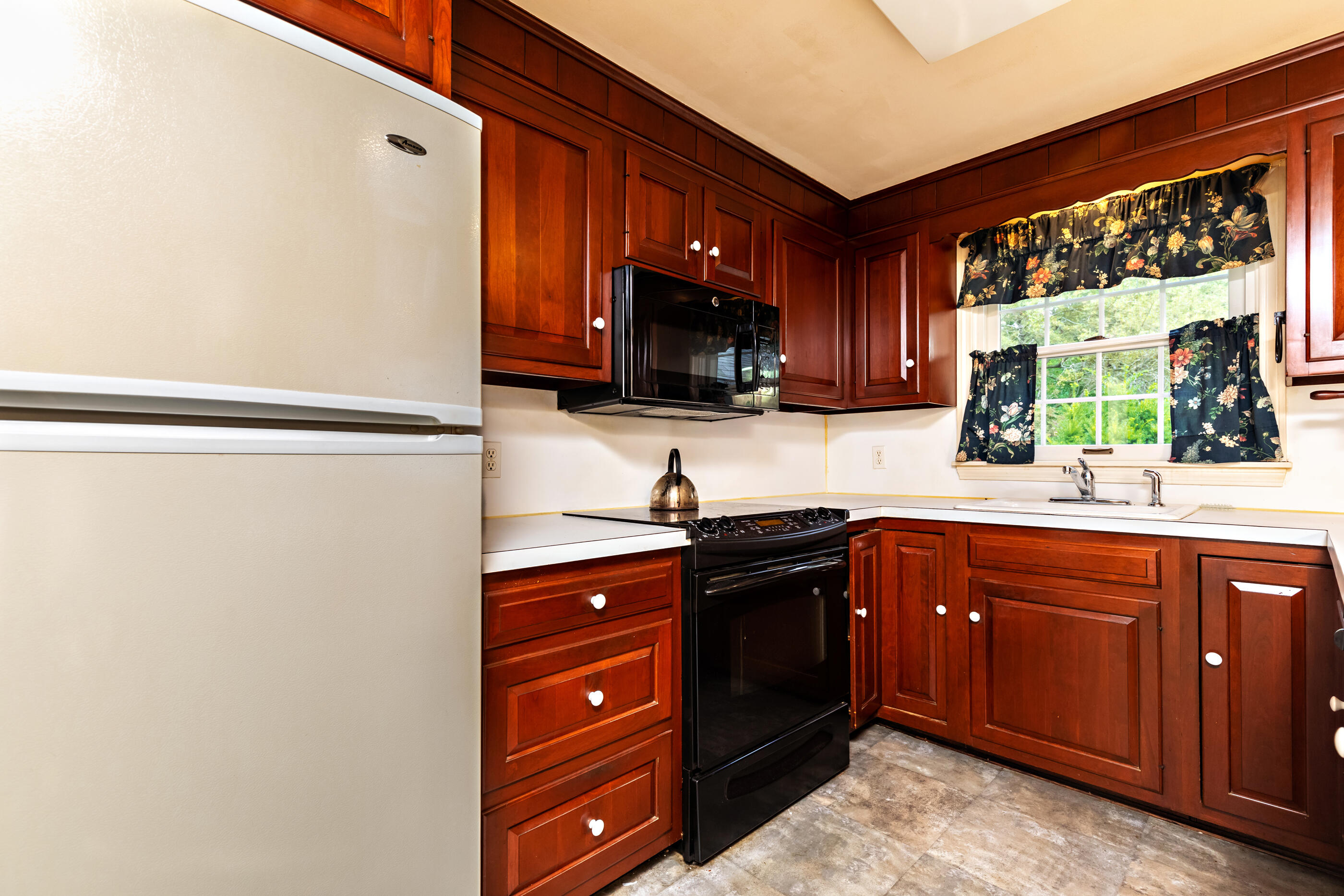 76 Goose Point Road Centerville, MA 02601 - Photo 11 of 34 a kitchen with stainless steel appliances granite countertop a refrigerator and a sink