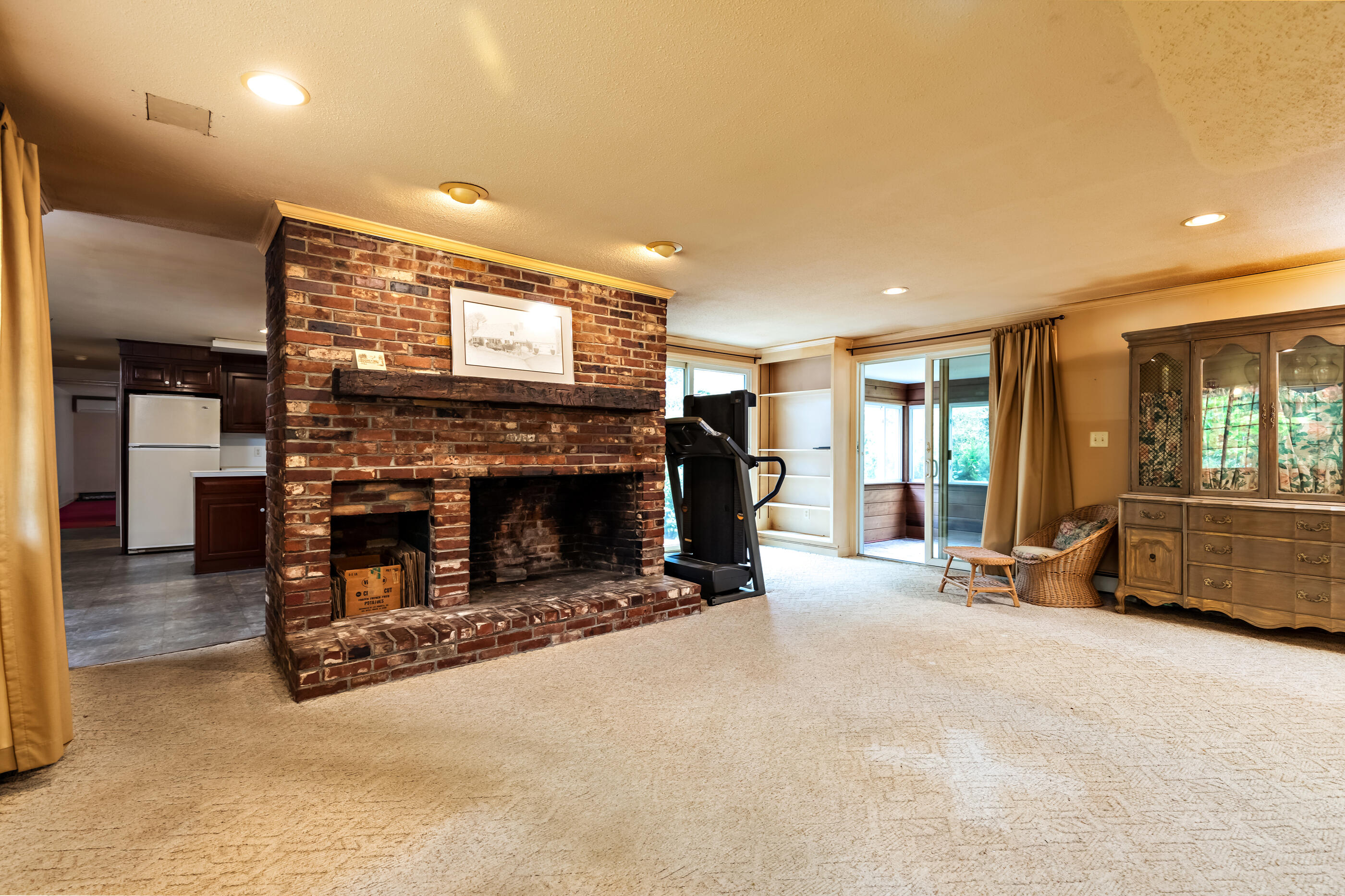 76 Goose Point Road Centerville, MA 02601 - Photo 14 of 34 a living room with furniture and a fireplace