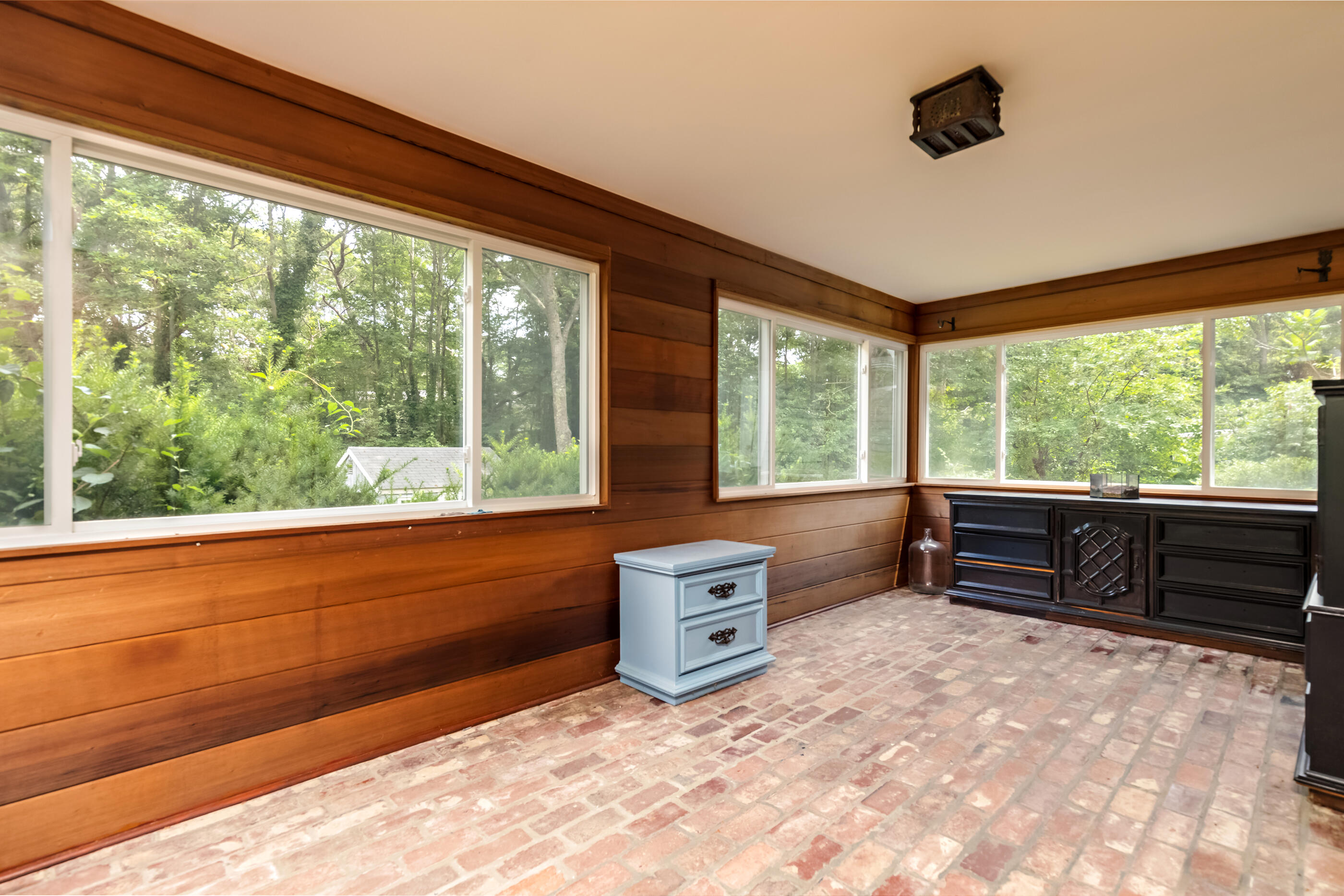 76 Goose Point Road Centerville, MA 02601 - Photo 16 of 34 a room with furniture and large windows
