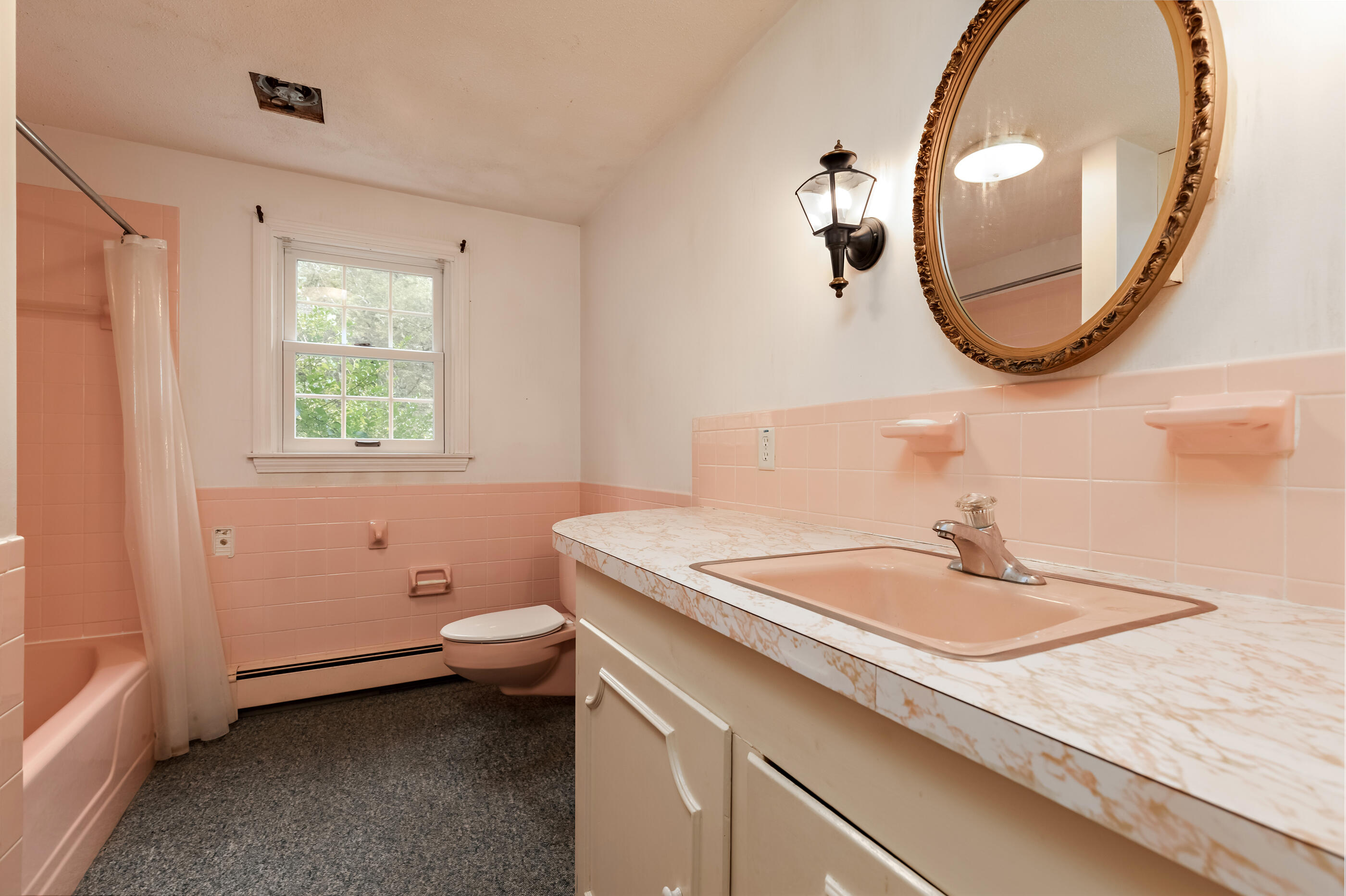 76 Goose Point Road Centerville, MA 02601 - Photo 21 of 34 a bathroom with a sink a toilet and a mirror