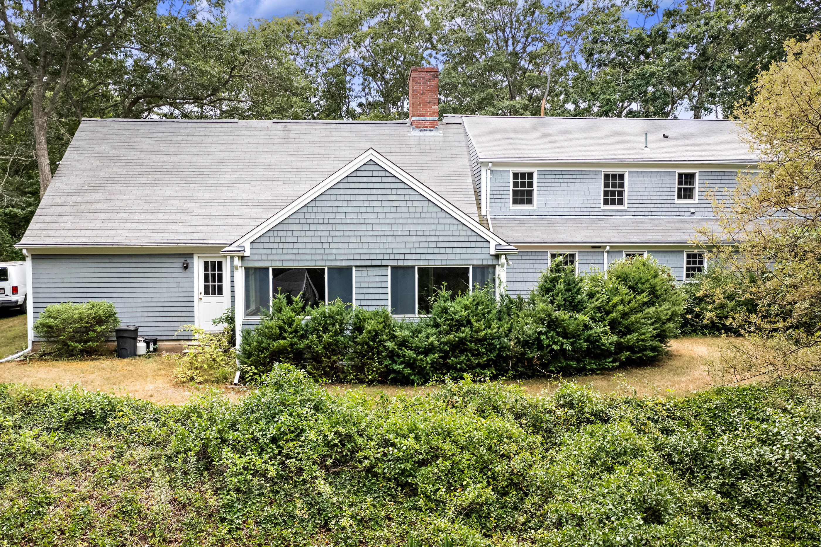 76 Goose Point Road Centerville, MA 02601 - Photo 8 of 34 front view of a house with a yard