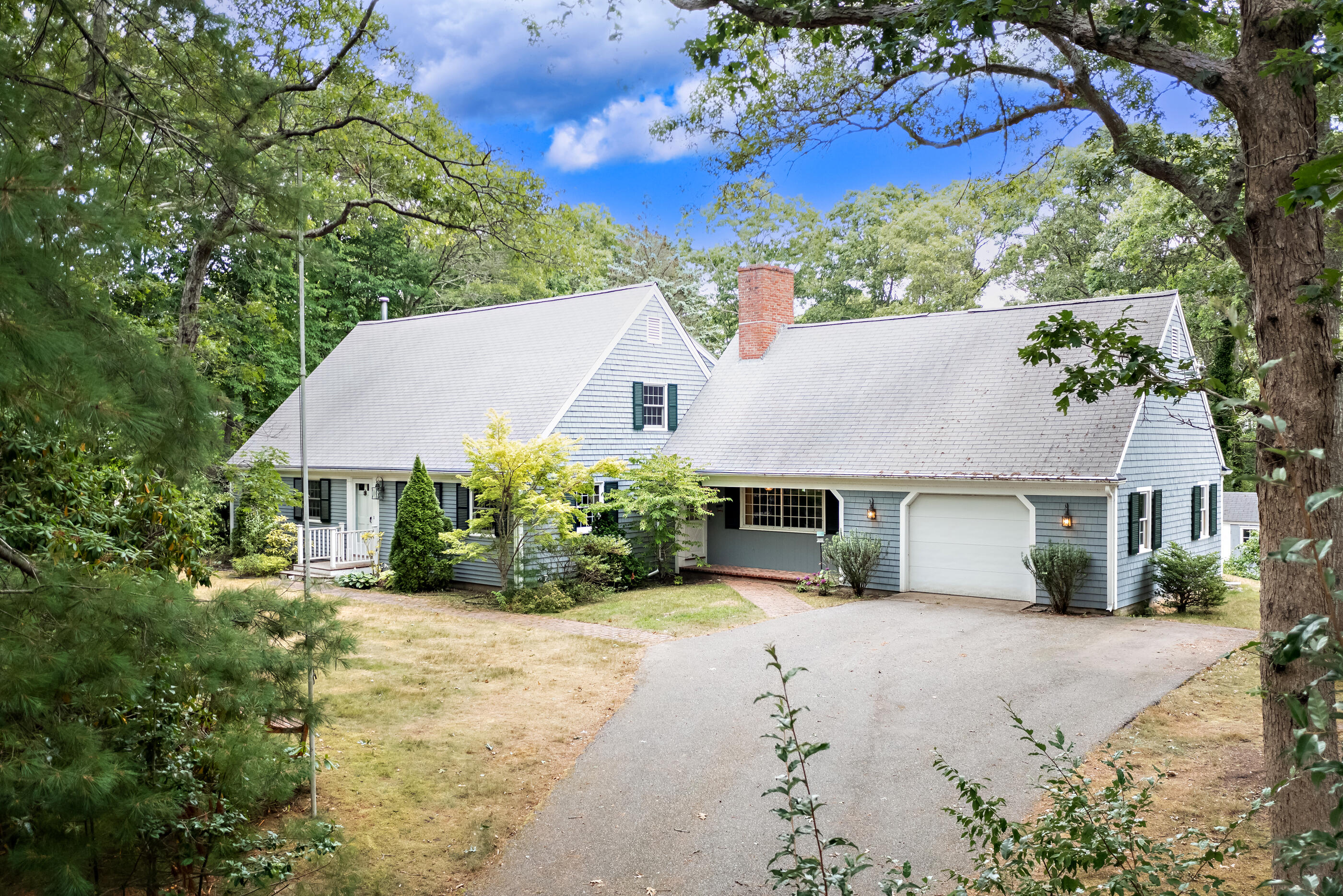 76 Goose Point Road Centerville, MA 02601 - Photo 9 of 34 a view of a house with a yard and potted plants