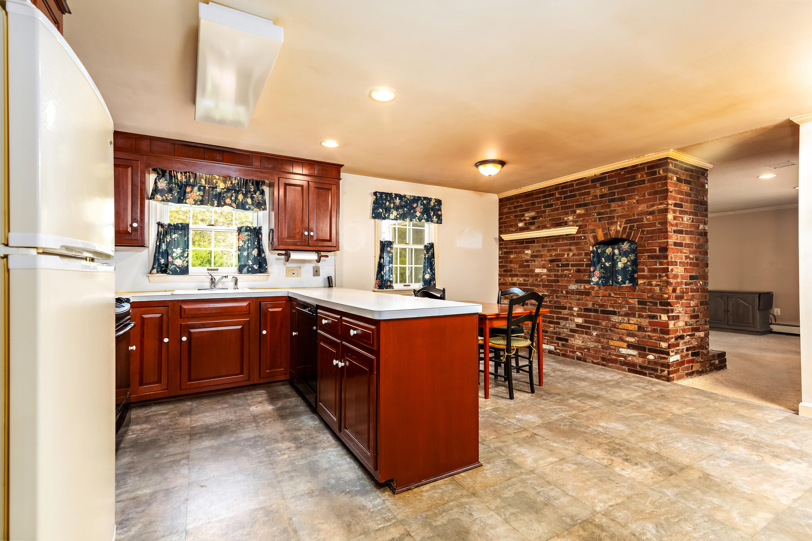 76 Goose Point Road Centerville, MA 02601 - Photo 10 of 34 a kitchen with stainless steel appliances granite countertop a stove a sink and a refrigerator