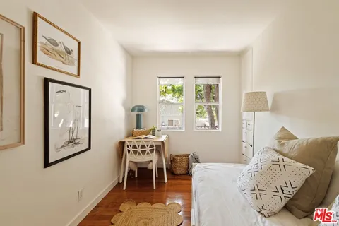 a view of a dining room with furniture and a window