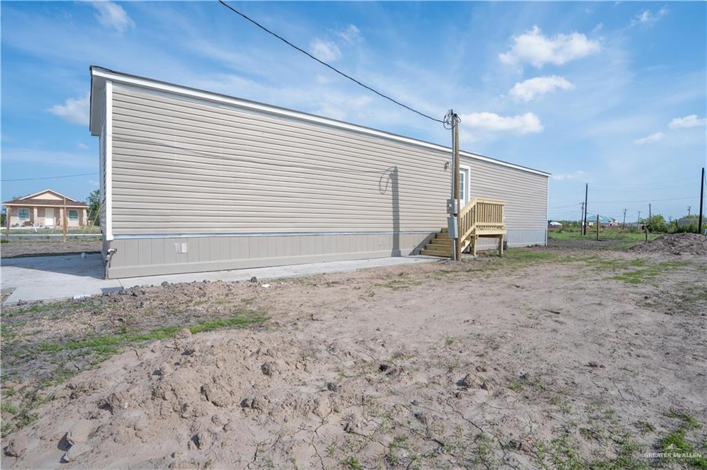 36042 Ranch Park Road San Benito, TX 78586 - Photo 2 of 25 a view of backyard with green space