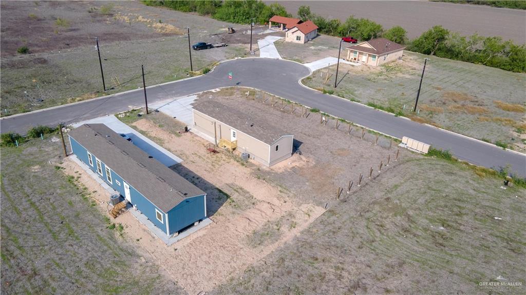 36042 Ranch Park Road San Benito, TX 78586 - Photo 21 of 25 an aerial view of a house with a yard
