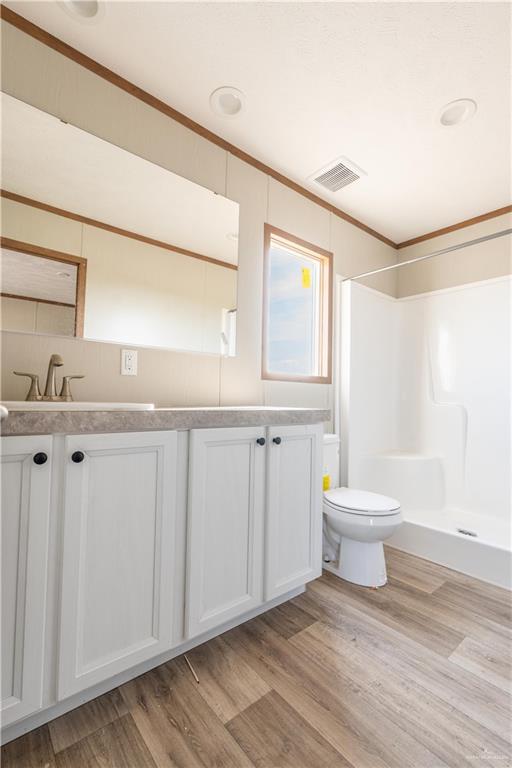 36042 Ranch Park Road San Benito, TX 78586 - Photo 9 of 25 a bathroom with a sink a toilet and a window