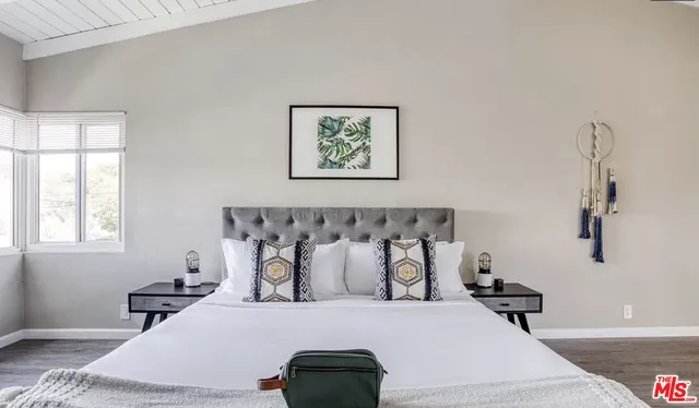 a bathroom with a bathtub and a window