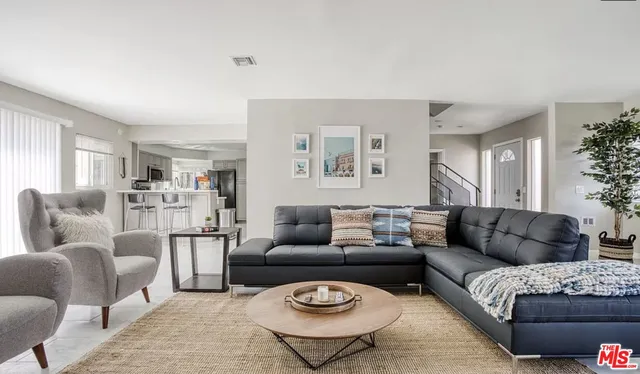 a living room with furniture and a couch